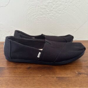 Black Tom’s, in very good used condition - slip ons
